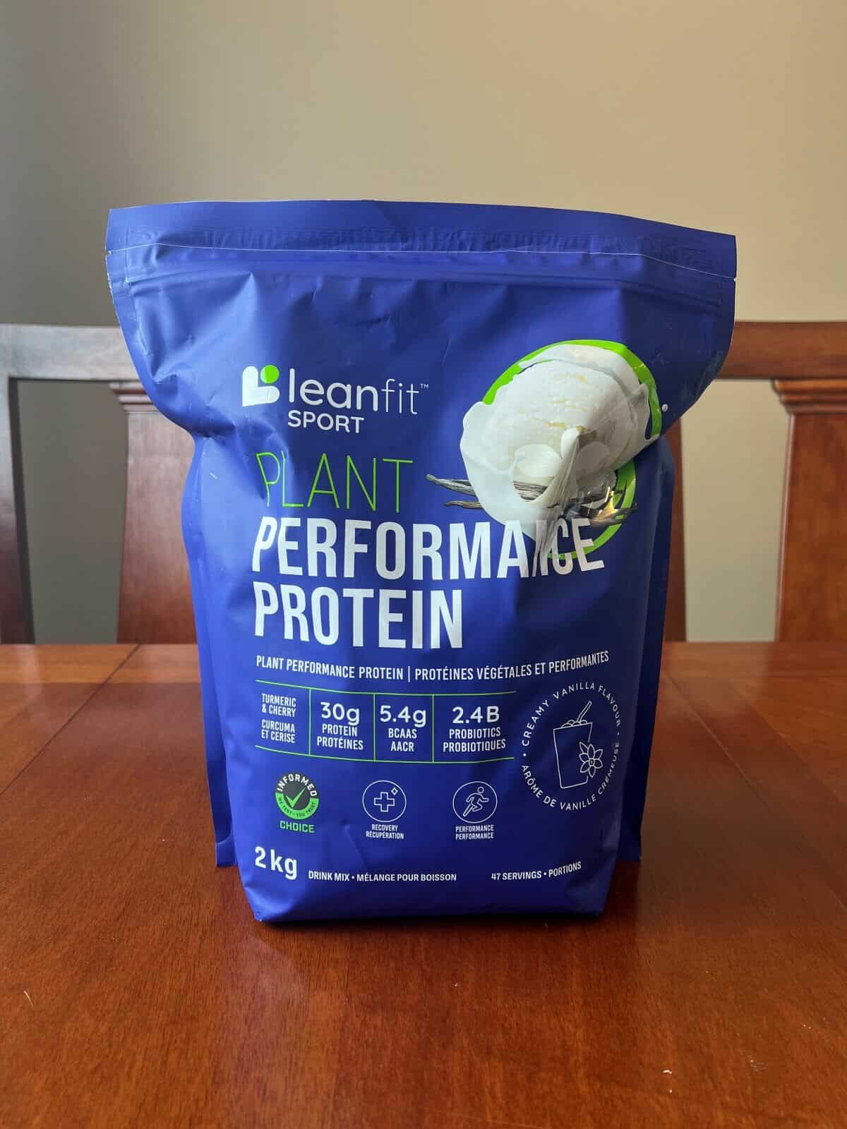 Image of the Leanfit Sport Plant Performance Protein bag sitting on a table. 