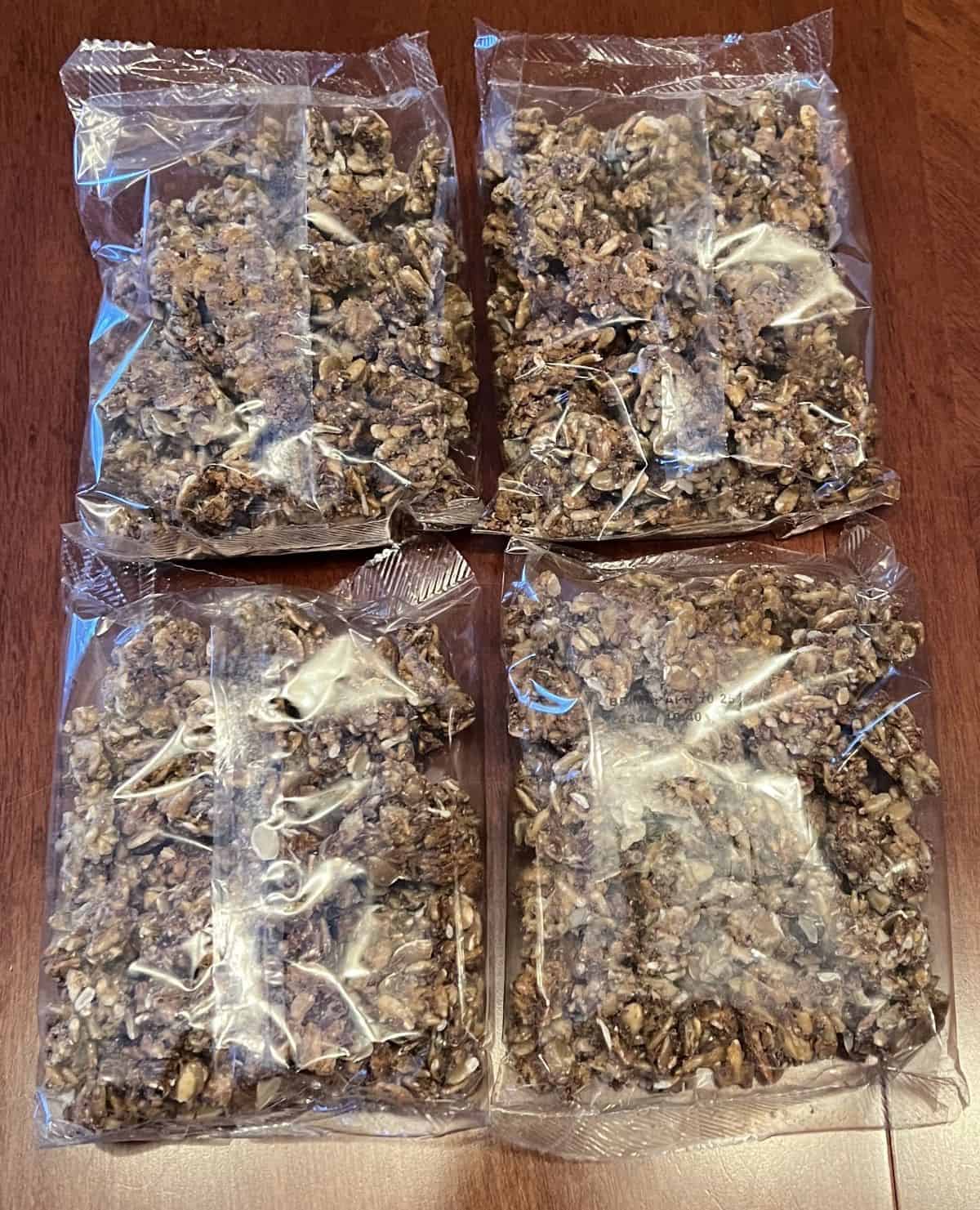 Image of four sealed bags of clusters sitting on a table.