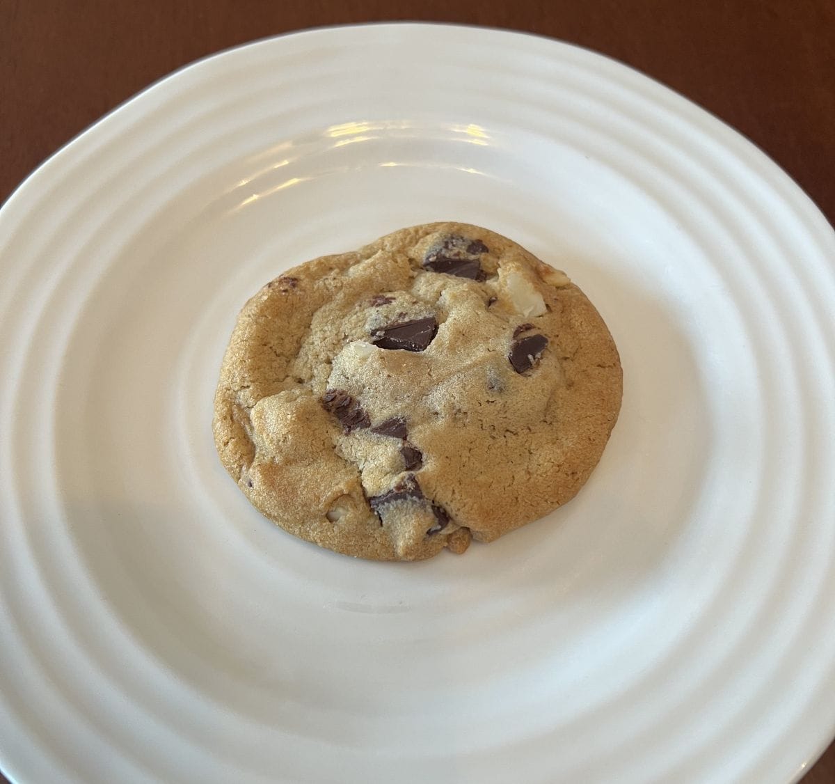 Image of one cookie served on a white plate.