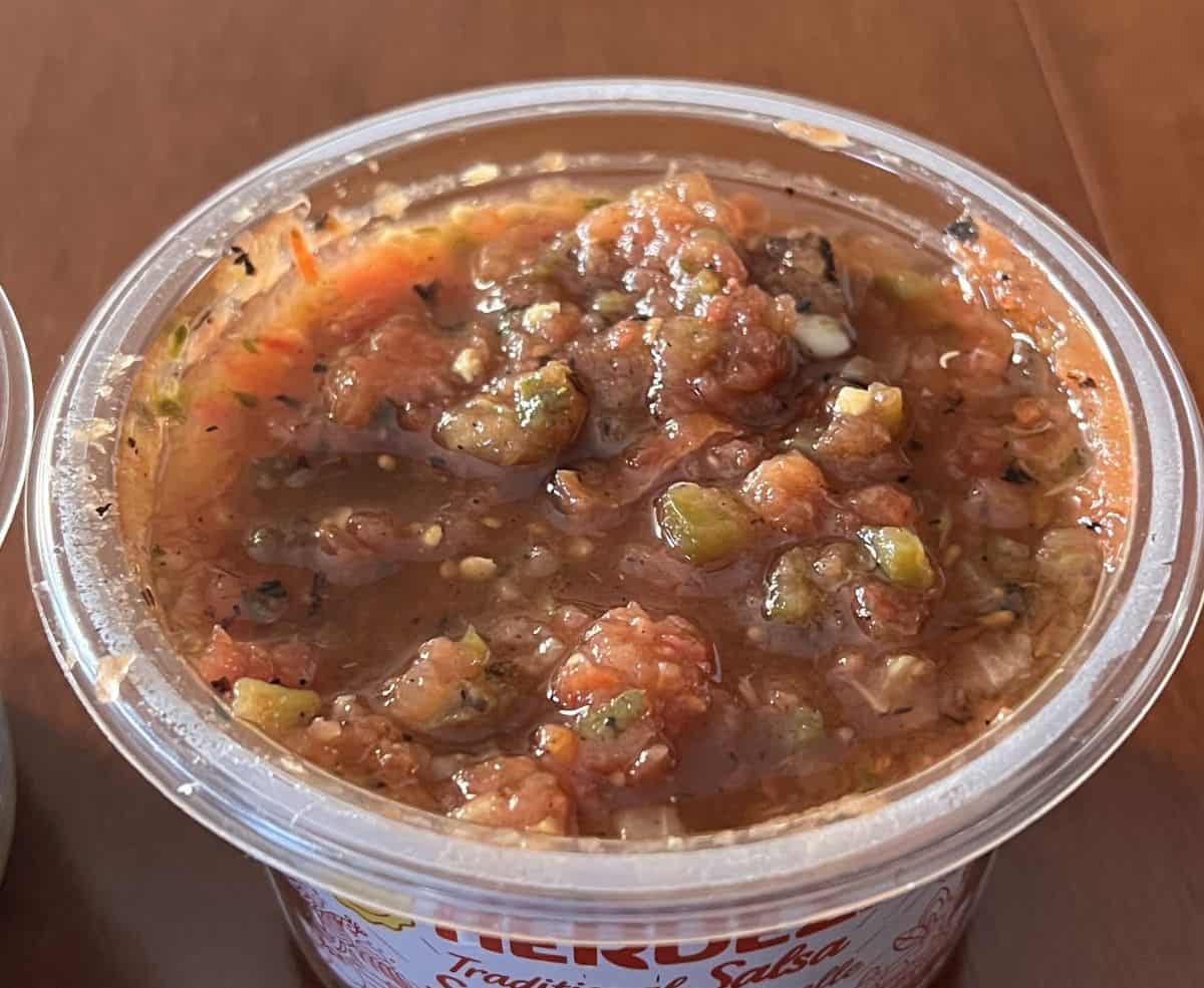 Closeup image of an open container of the traditional salsa.